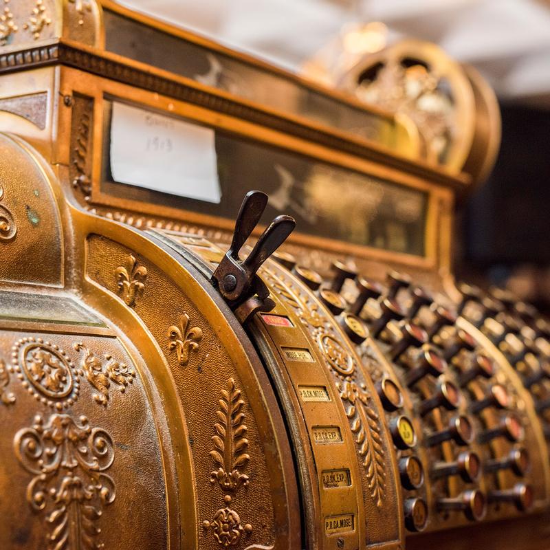 The antique brass register that has rung up dinners since 1959