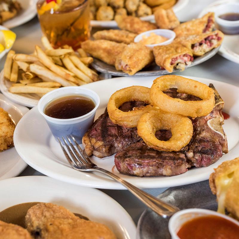 Hand-cut steak with beer-battered onion rings